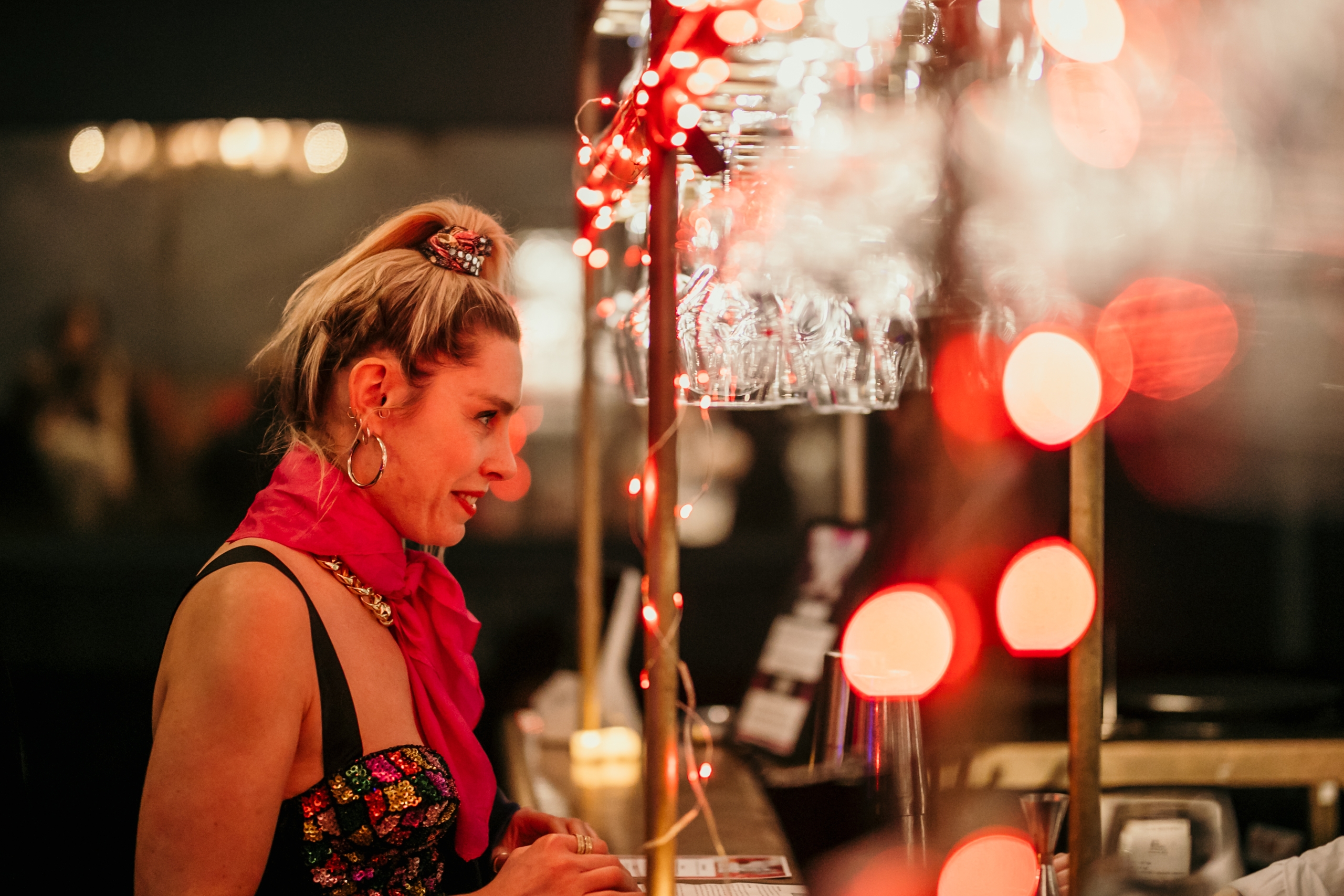 Photo of a girl ordering a drink at the bar.
