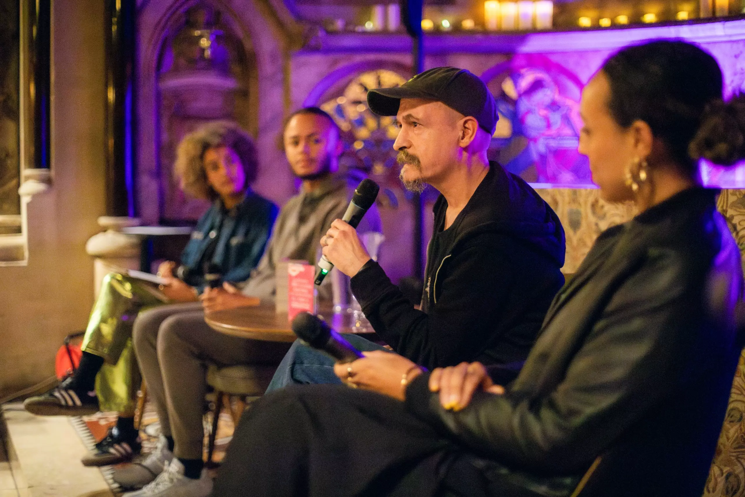 Photo of people having a discussion in the chapel.